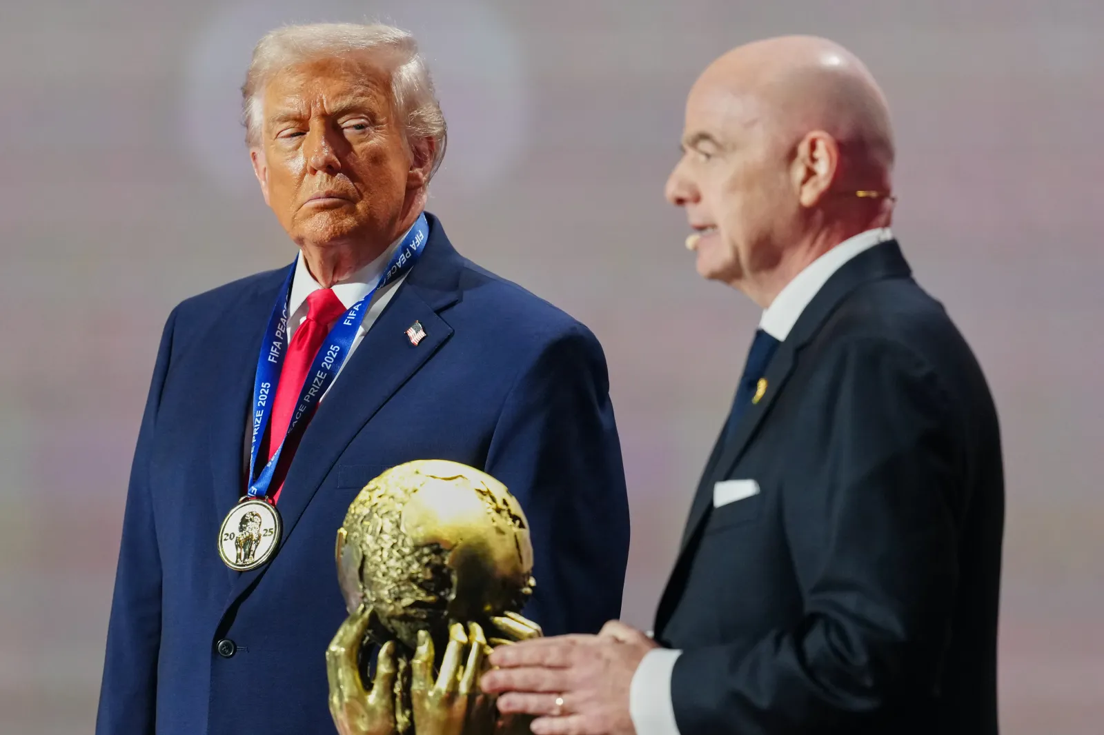 President Donald Trump receives the FIFA Peace Prize from FIFA President Gianni Infantino during the draw for the 2026 soccer World Cup at the Kennedy Center in Washington, D.C., on December 5.